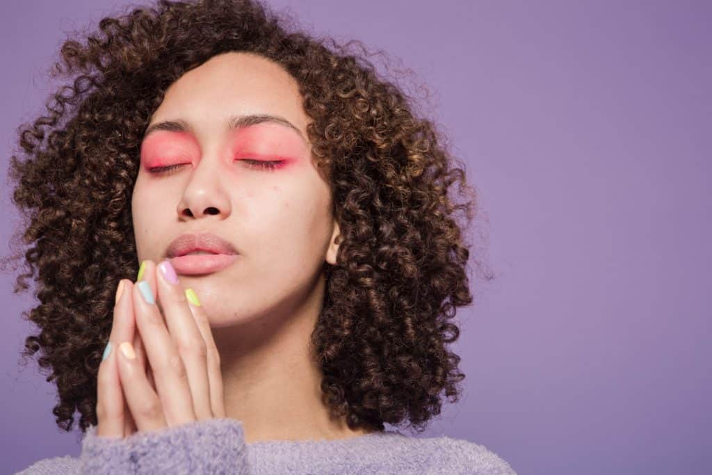 Woman with eyes closed