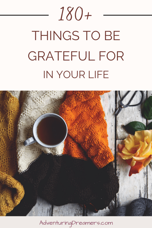 Blankets are arranged nicely next to a cup of coffee. Text reads, "180+ things to be grateful for in your life. Adventuringdreamers.com"