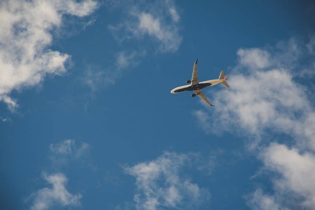 An airplane flies in the sky.