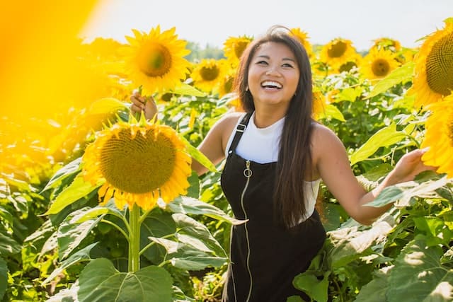 A woman posing for a photo - a unique travel gifts for women.