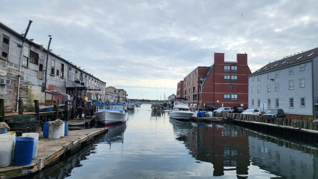 A small harbor in an industrial looking area.