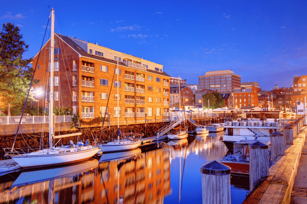 A wharf filled with boats at twilight