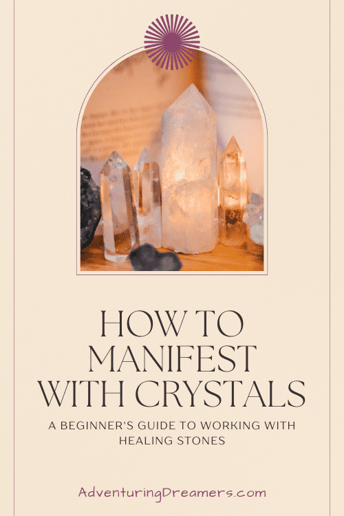 A arched window reveals a line of crystals lit up by a candle behind them. The text underneath reads, "How to manifest with crystals: A beginner's guide to working with healing stones. Adventuringdreamers.com"