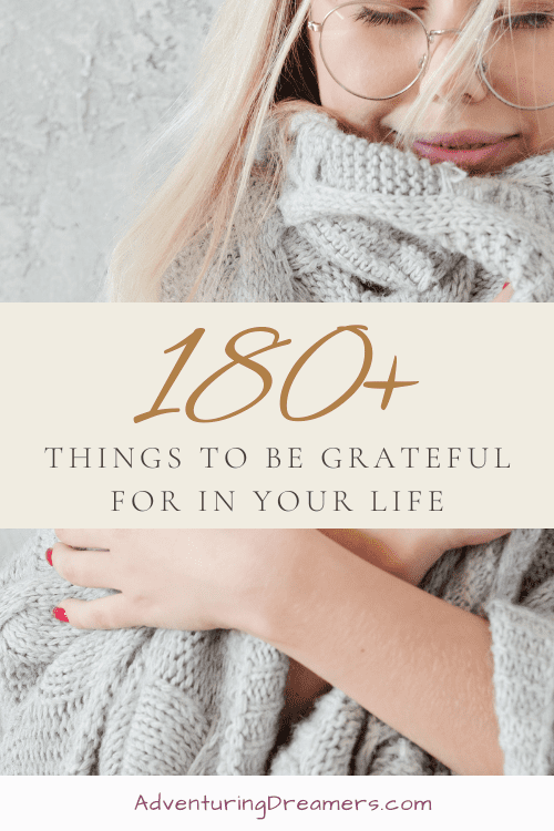 A woman snuggles in a blanket. Text reads, "180+ things to be grateful for in your life. Adventuringdreamers.com"