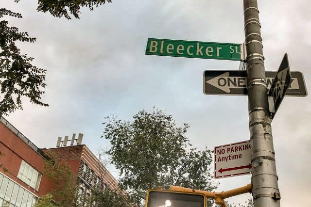 A road sign indicating Bleeker St.
