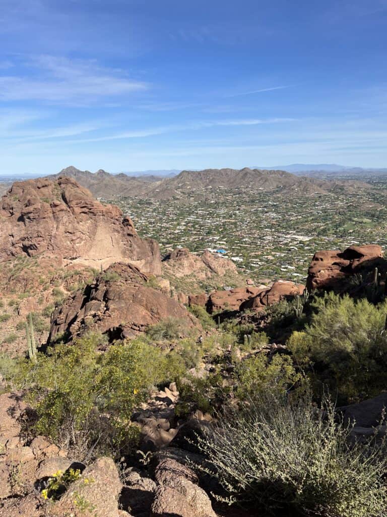 A desert peak overlooking a housing community. Camelback, one of the best peak hikes near Tucson.