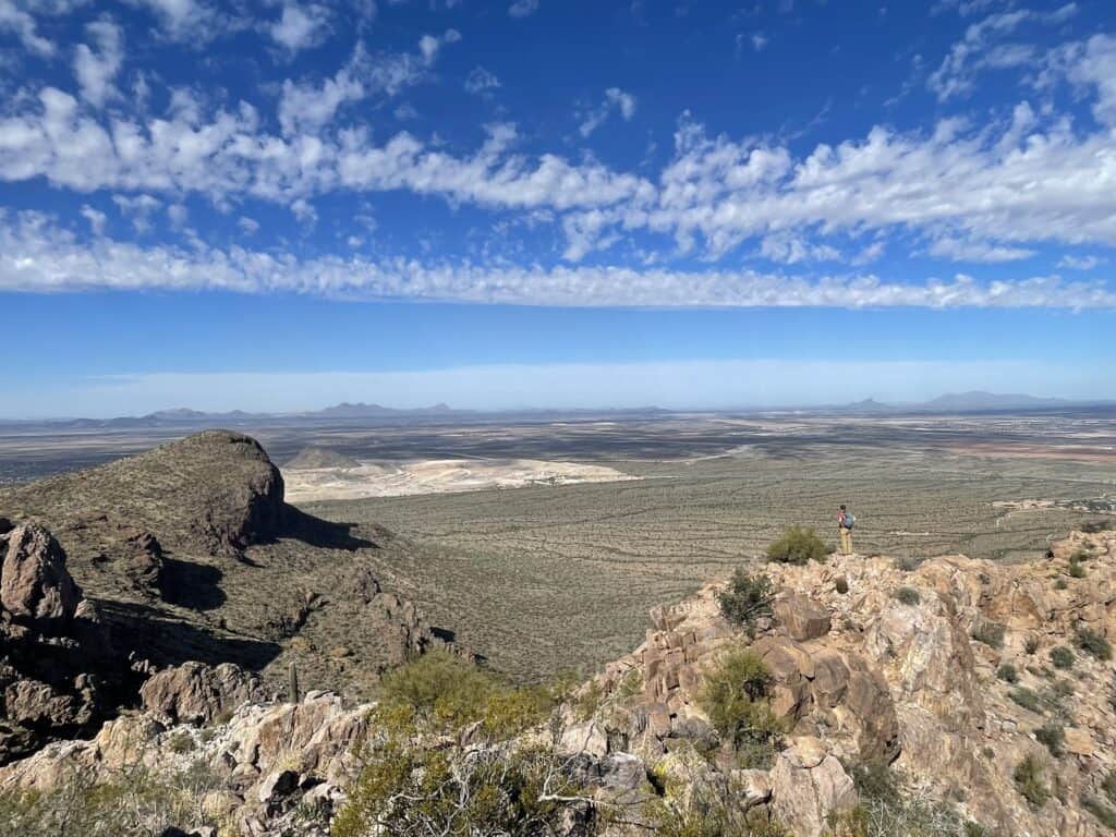 A big blue sky across a desert landscape. Safford/Sombrero is one of the best peak hikes near Tucson.