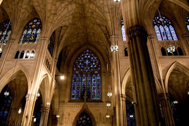 An interior shot of a church with gothic-style architecture.