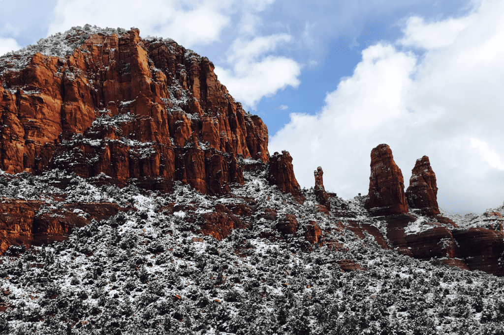 The majestic red rock of Sedona is covered in powdery snow.