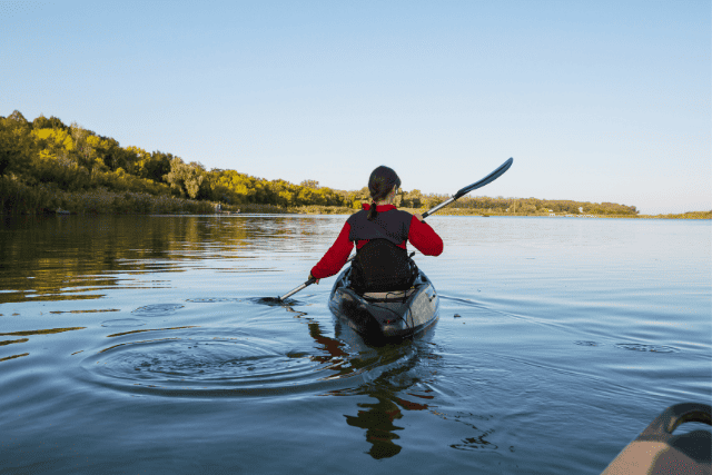 A woman kayaking and thinking about all the fun things to do in Portland, Maine